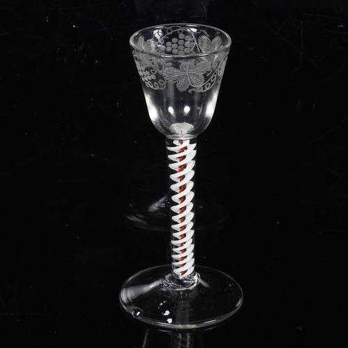 166 - A mid-18th century brick twist stem drinking glass, with etched grapevine bowl and double-twist stem... 