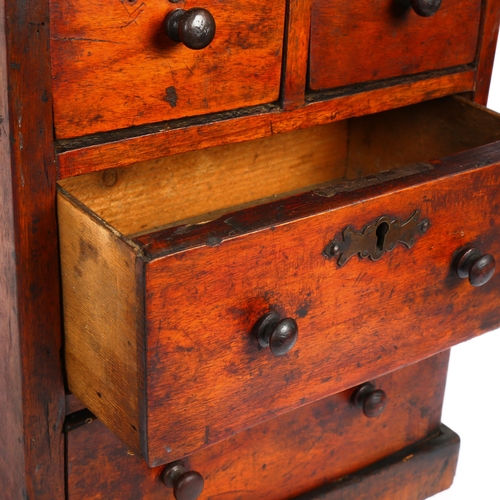 18 - A Vintage stained pine table-top chest of drawers, height 40cm