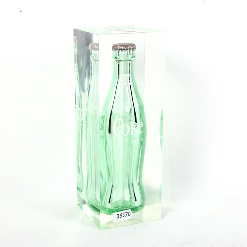 180 - A Vintage Lucite encased Coca-Cola bottle sculpture, height 22cm