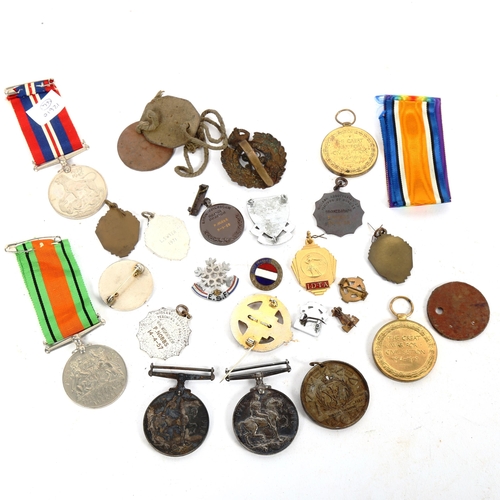 187 - Various First and Second World War medals and badges, including pair and dog tags to 100534 Spr W He... 