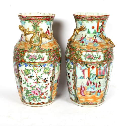 213 - A pair of Chinese Canton famille rose vases, with enamelled courtyard decoration, with applied gilde... 