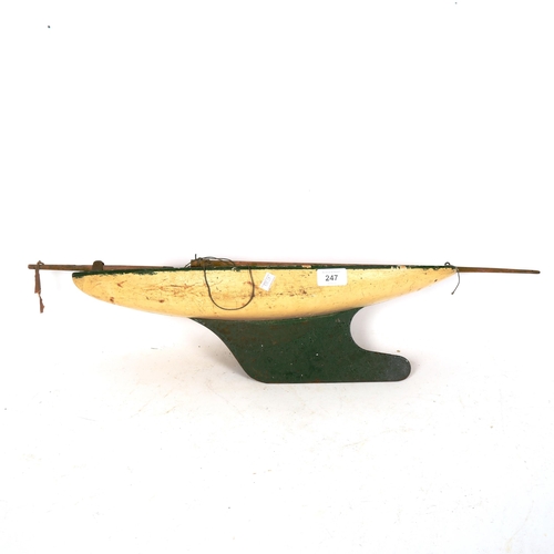 247 - A Vintage painted wooden-hulled pond yacht, length 53cm