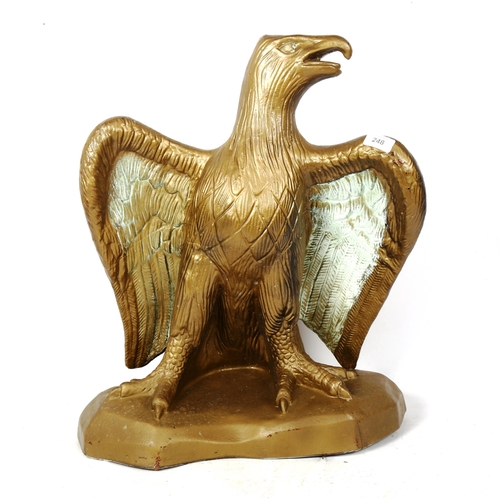 248 - A large gold painted pottery eagle sculpture, unsigned, height 57cm, width 50cm