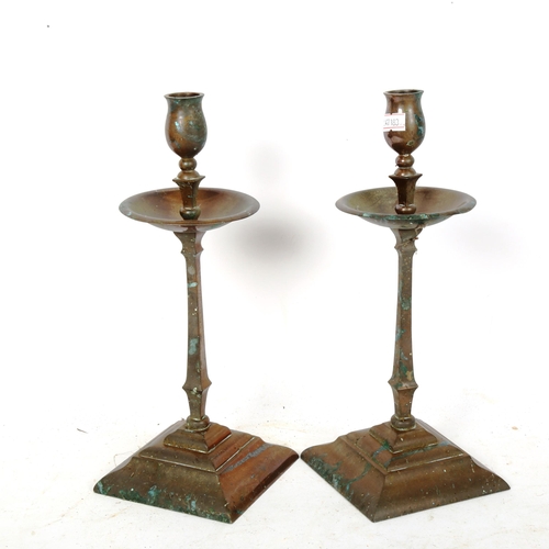 250 - A pair of Arts and Crafts style copper candlesticks, with drip pans, height 29cm