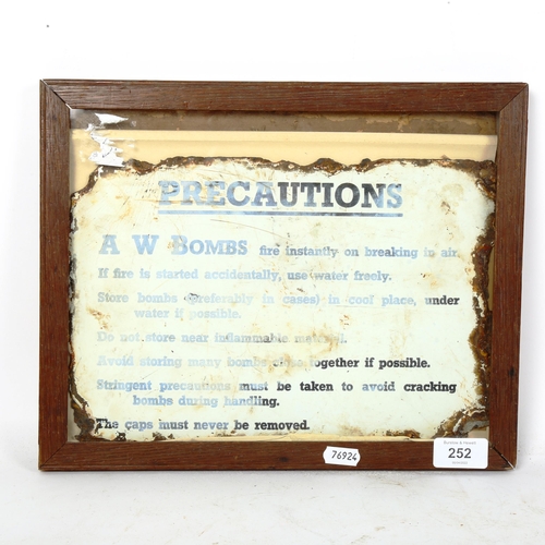 252 - A Vintage A W Bombs Precaution enamel sign, 20cm x 30cm, framed