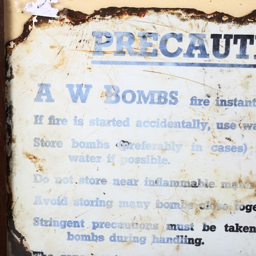 252 - A Vintage A W Bombs Precaution enamel sign, 20cm x 30cm, framed