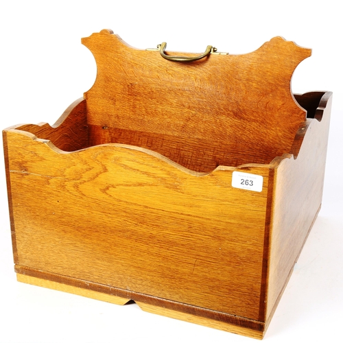 263 - A large light oak bottle carrier, with brass handle, W40cm, H37cm, D45cm