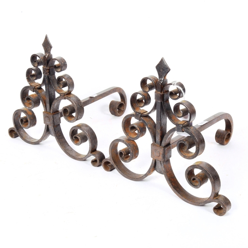 264 - A pair of wrought-iron scroll andirons, height 24cm