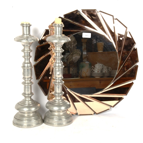 265 - An Art Deco style peach and clear glass circular wall mirror, and a large pair of Spanish pewter can... 