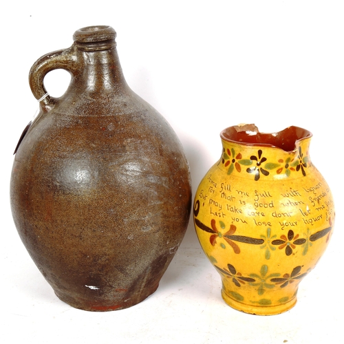 273 - A large stoneware pottery wine flagon, and an Aller Vale motto jug, largest height 34cm (both A/F)