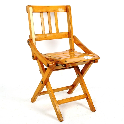 275 - A mid-century Italian Brevetti Reguitti child's folding chair, for Fratelli, height 46cm