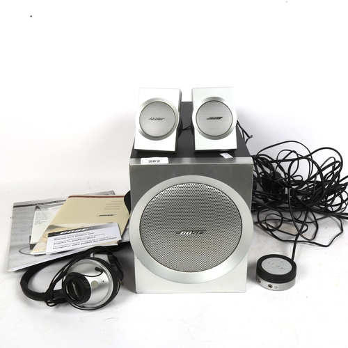 282 - A Bose Companion 3 multimedia speaker system, and a pair of Bose around-ear headphones, with instruc... 