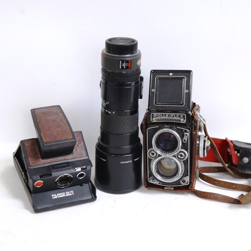 294 - A Vintage Rolleiflex twin lens reflex camera, Sigma telephoto 400mm lens etc