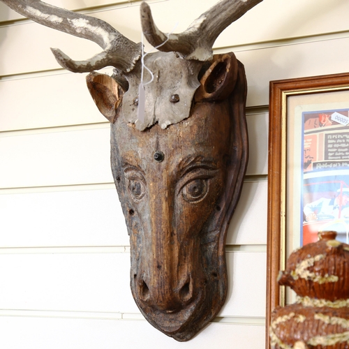 65 - A Folk Art pine deer's head with antlers, overall height 85cm