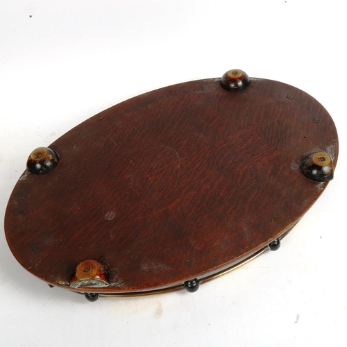 70 - A brass-mounted oak oval drinks' tray, 45cm x 30cm