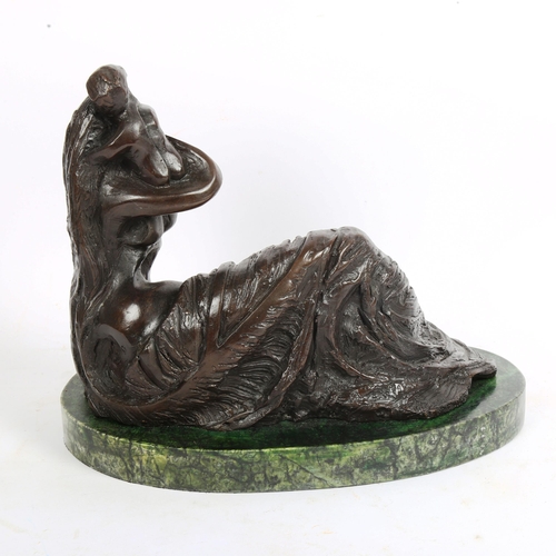 73 - A large modernist bronze sculpture, mother and child, indistinctly signed on her robe, on green marb... 