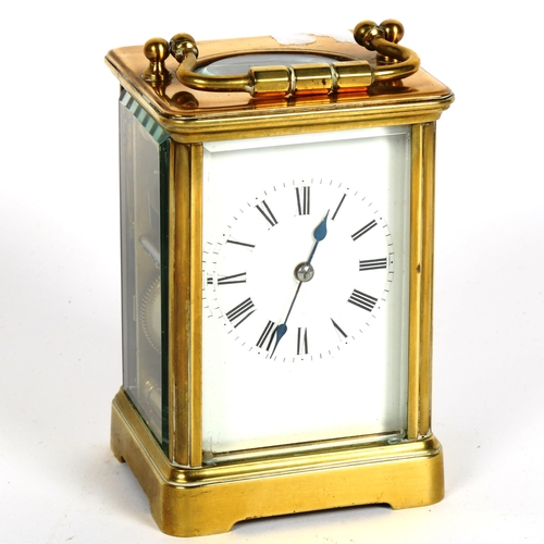 87 - A brass-cased carriage clock, with movement striking on a gong, case height 12.5cm