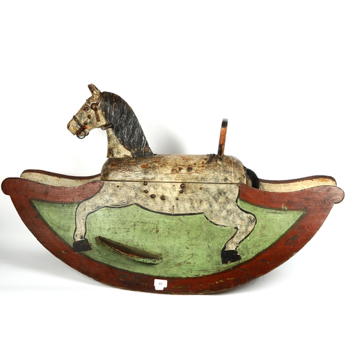 95 - A child's Vintage painted wood rocking horse, length 103cm