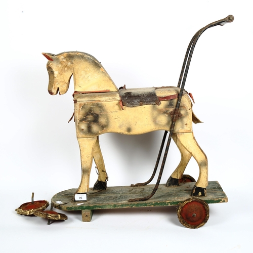 96 - A child's Vintage painted wood push-along horse toy, length 60cm