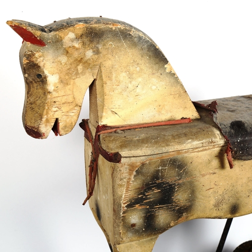 96 - A child's Vintage painted wood push-along horse toy, length 60cm