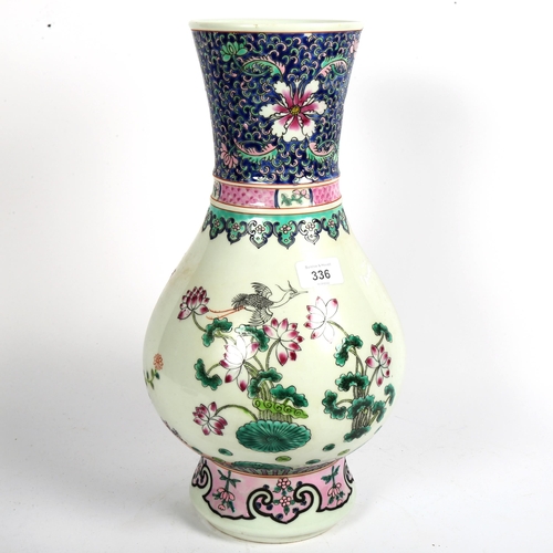 336 - A large Chinese famille rose baluster vase, peacock and chrysanthemum decoration, 6 character mark o... 