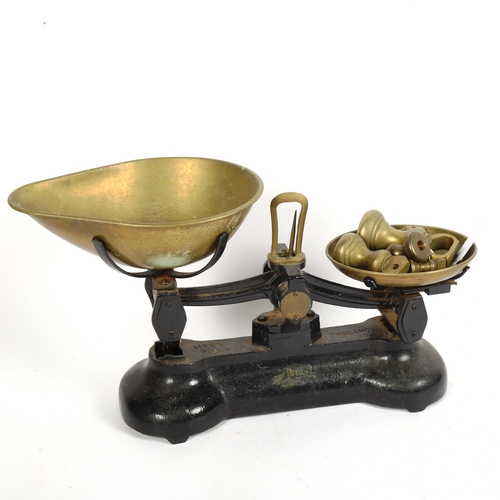 339 - A pair of Libra cast-iron balance scales with weights, base length 32cm