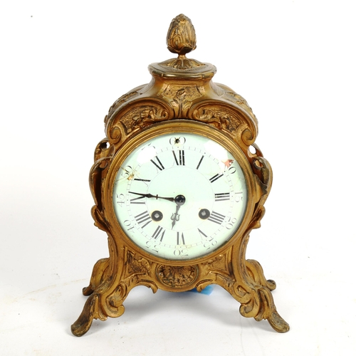 348 - A French Art Nouveau gilded spelter 8-day mantel clock, height 26cm, with pendulum and key