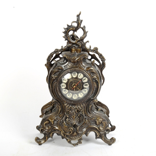 356 - An Antique style cast-metal clock, with scrolled decoration, and quartz movement, height 38cm