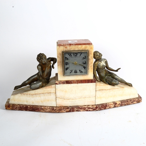 364 - A large Art Deco pink marble and alabaster 8-day mantel clock, surmounted by spelter figures, width ... 