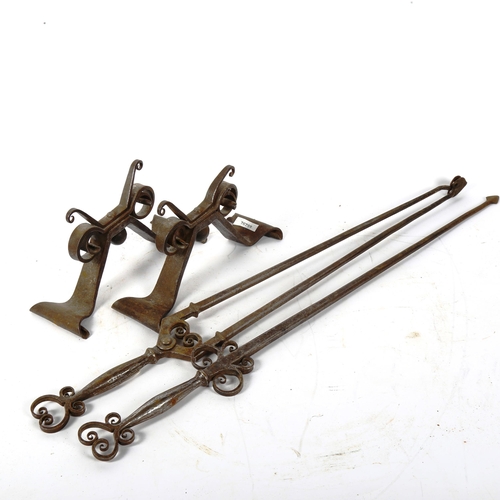 368 - A forged iron fire companion set, comprising pair of andirons, poker and tongs (3)