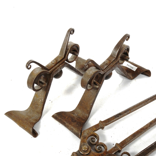 368 - A forged iron fire companion set, comprising pair of andirons, poker and tongs (3)