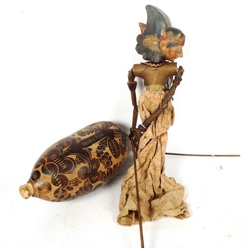 389 - A Thai painted wood puppet figure, and an African gourd flask, height 32cm (2)