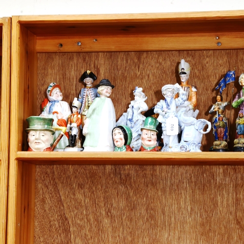 692 - A shelf of figures, Beswick character jugs etc