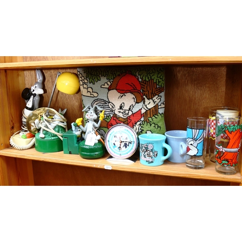 694 - A shelf of Bugs Bunny memorabilia, including a clock and lamp