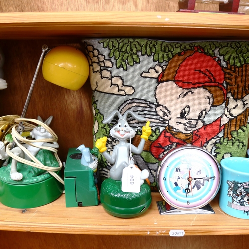 694 - A shelf of Bugs Bunny memorabilia, including a clock and lamp