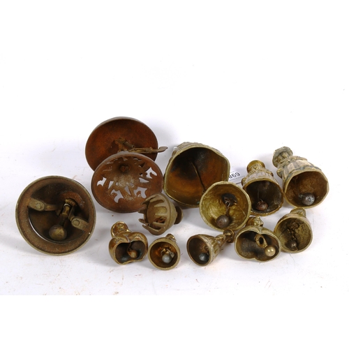 698 - A group of brass figure bells etc