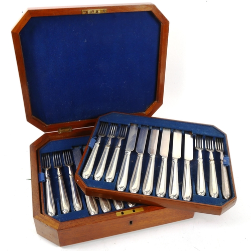 1013 - A canteen of silver plated dinner knives and forks for 18 people, with bead edge handles and engrave... 