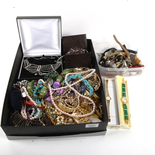 1023 - A large quantity of mixed costume jewellery, quartz wristwatches etc