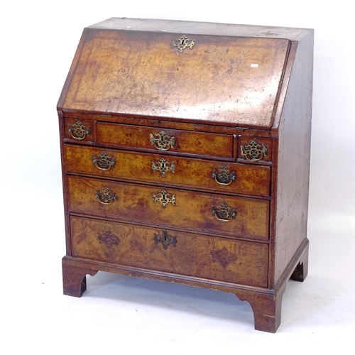 2004 - A Georgian mahogany and burr-walnut veneered bureau, the fall-front revealing a fitted interior, wit... 