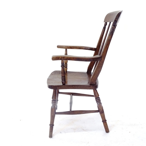 2007 - A Victorian and oak elm seated Windsor kitchen armchair