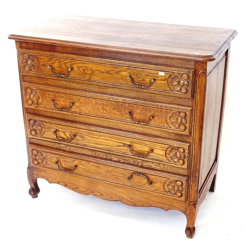 2010 - A French oak chest of 4 long drawers with carved decoration, W98cm, H90cm, D51cm