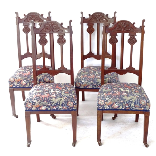 2014 - A set of 4 Arts and Crafts style tapestry upholstered dining chairs