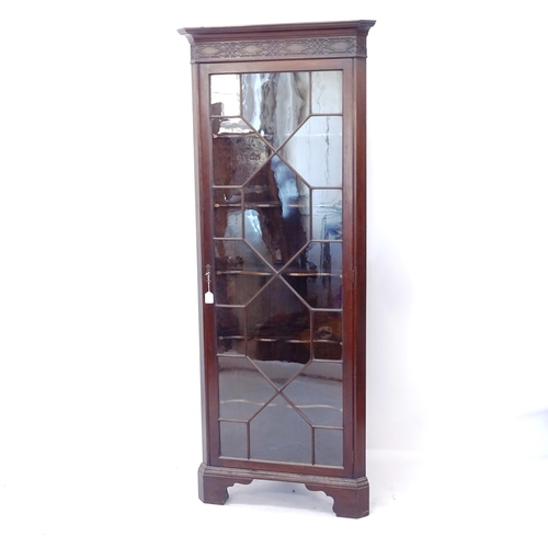 2016 - An Edwardian mahogany corner display cabinet, with single lattice-glazed door, on bracket feet, W80c... 