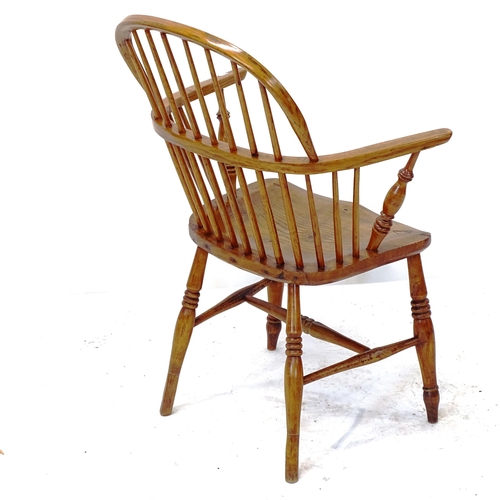 2022 - An oak spindle-back bow-arm chair