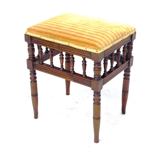 2023 - An Antique mahogany spindle turned rectangular upholstered piano stool