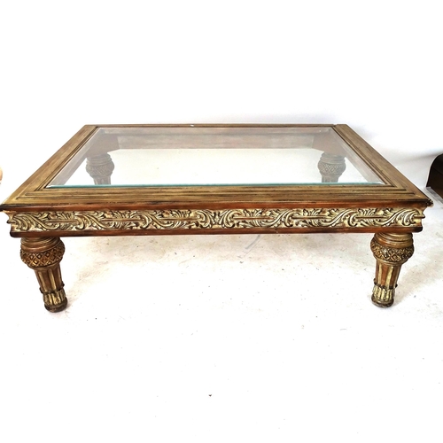 2030 - An American rectangular coffee table with central glass top, carved frieze, on turned legs, W143cm, ... 