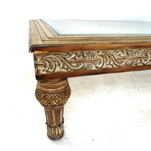 2030 - An American rectangular coffee table with central glass top, carved frieze, on turned legs, W143cm, ... 