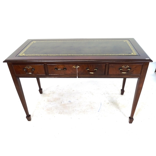 2046 - A reproduction mahogany writing table, with an inset green leather skiver, 3 frieze drawers, on squa... 