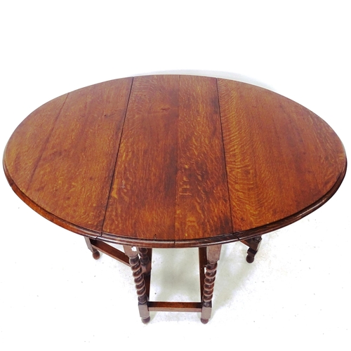 2047 - An oak oval barley twist gateleg table, W78cm, H73cm