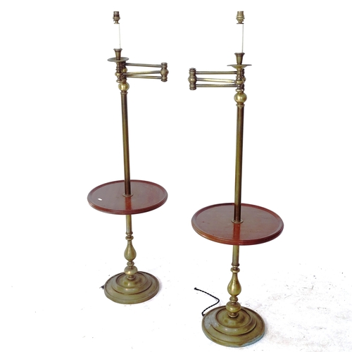 2060 - A pair of brass and mahogany library standard lamps, with integral shelf and adjustable arm, height ... 